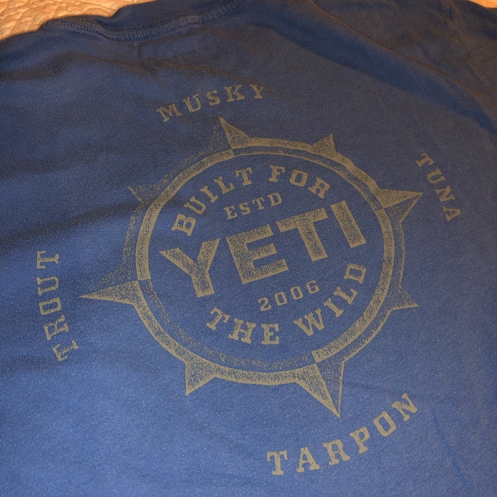 Men’s blue YETI shirt.
